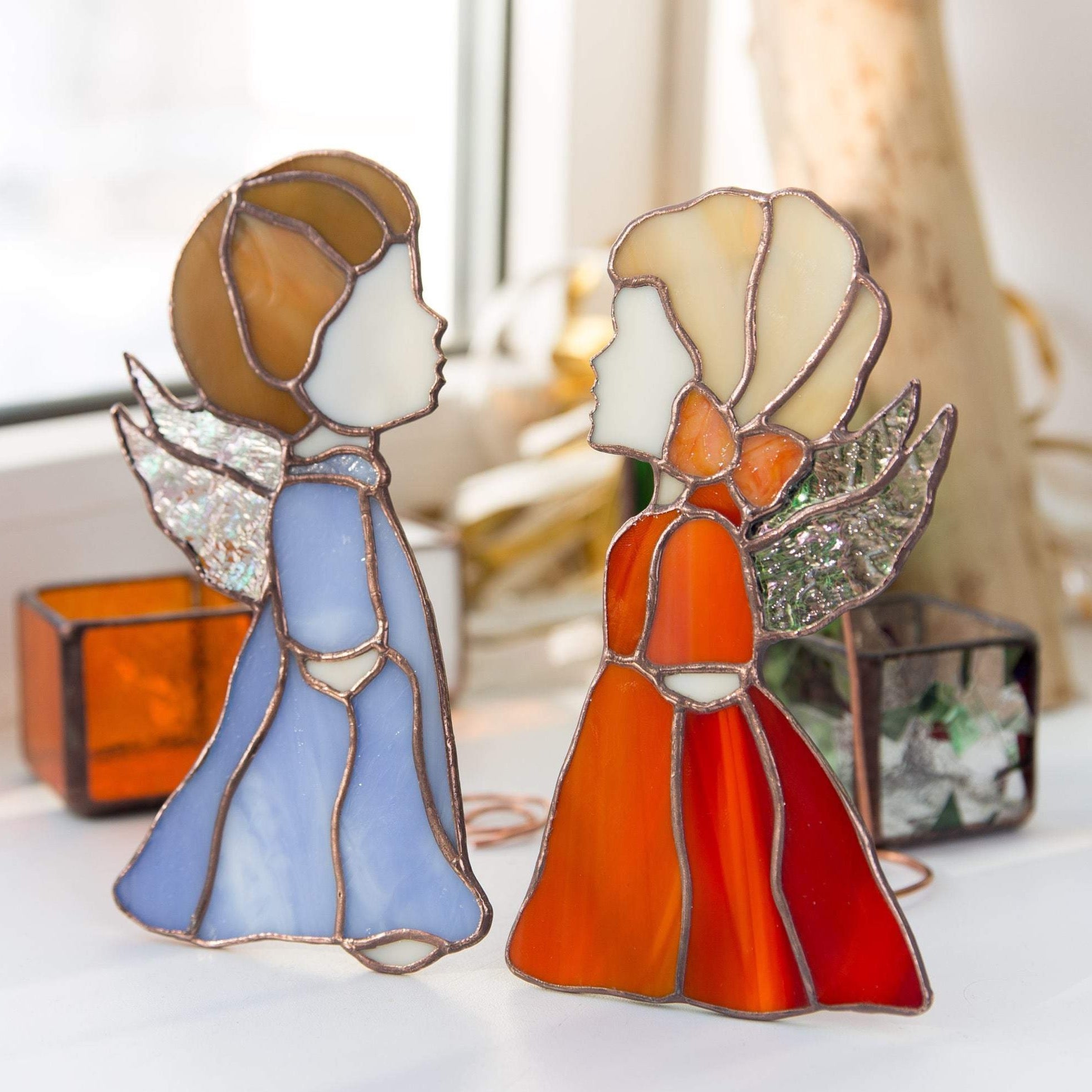 Pair of stained glass blue boy and red girl angels suncatachers