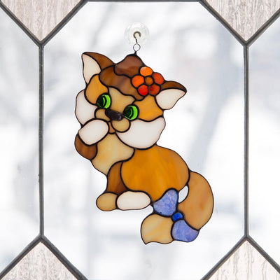 Stained glass kitty with the bow on the tail window hanging 