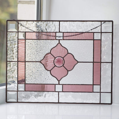 Pink beveled window hanging of stained glass