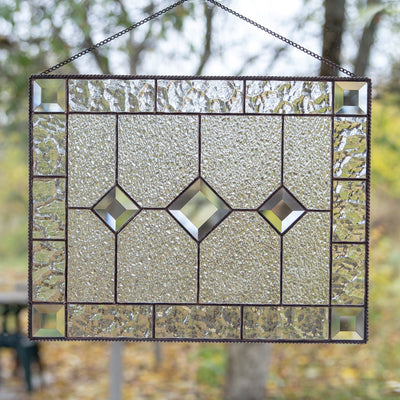 Stained glass clear panel with beveled inserts