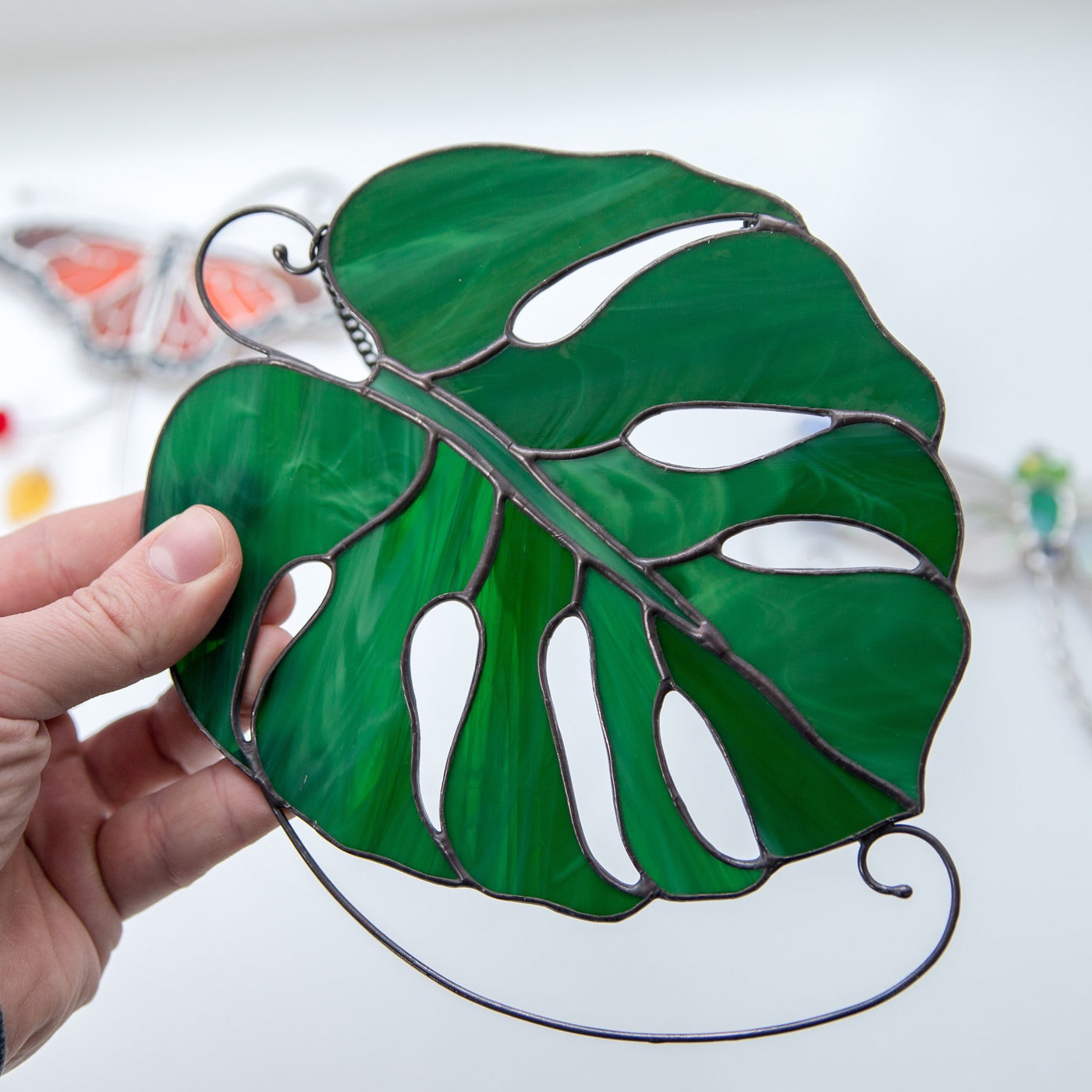 Suncatcher of a stained glass monstera leaf for home decor