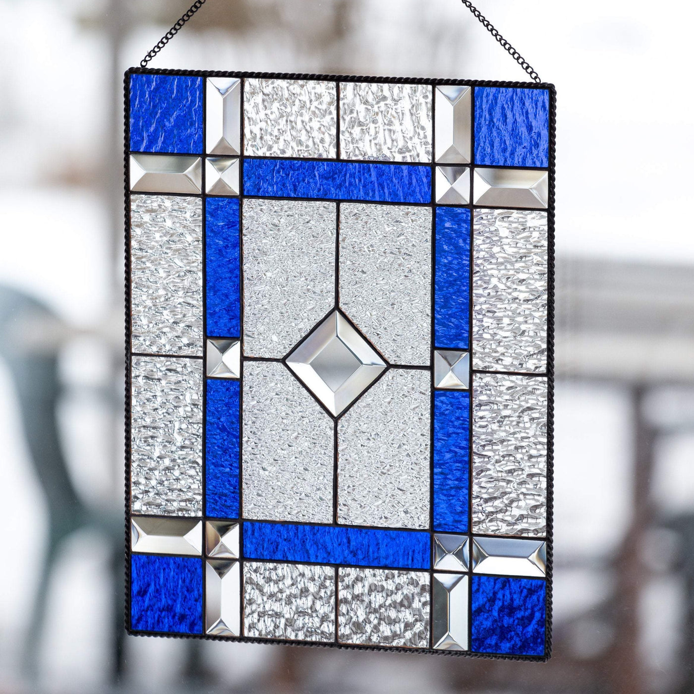 Cobalt and clear stained glass panel with beveled inserts