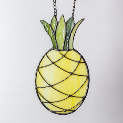 Window hanging of a stained glass pineapple