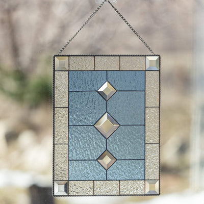 Stained glass beveled panel of blue colour with clear borders