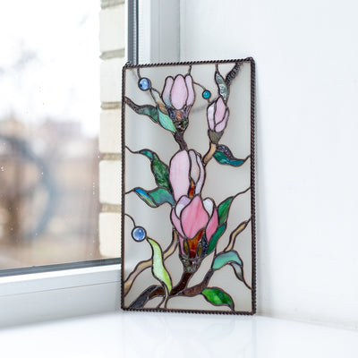 Magnolia flowers on white stained glass background panel 