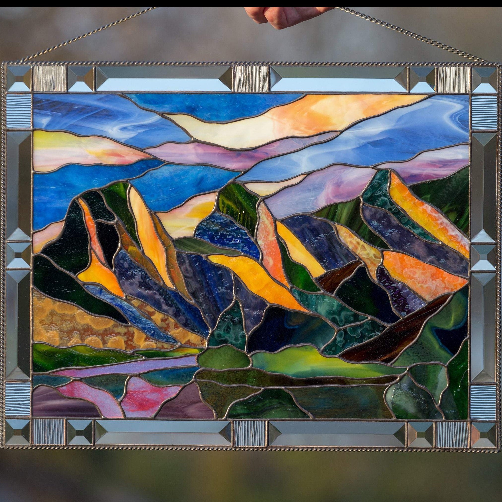Three Sisters Mountains panel of stained glass
