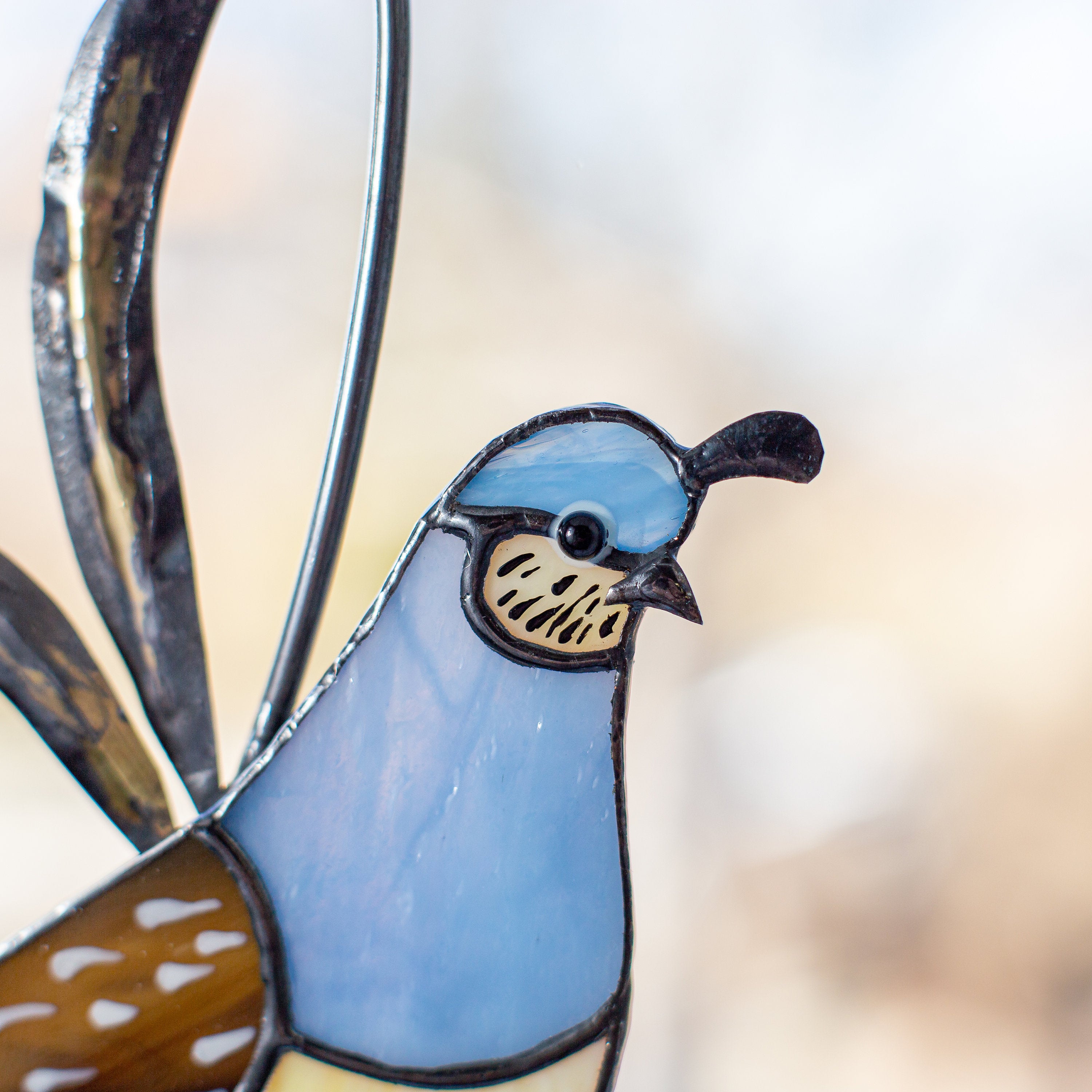 Zoomed stained glass female quail window hanging