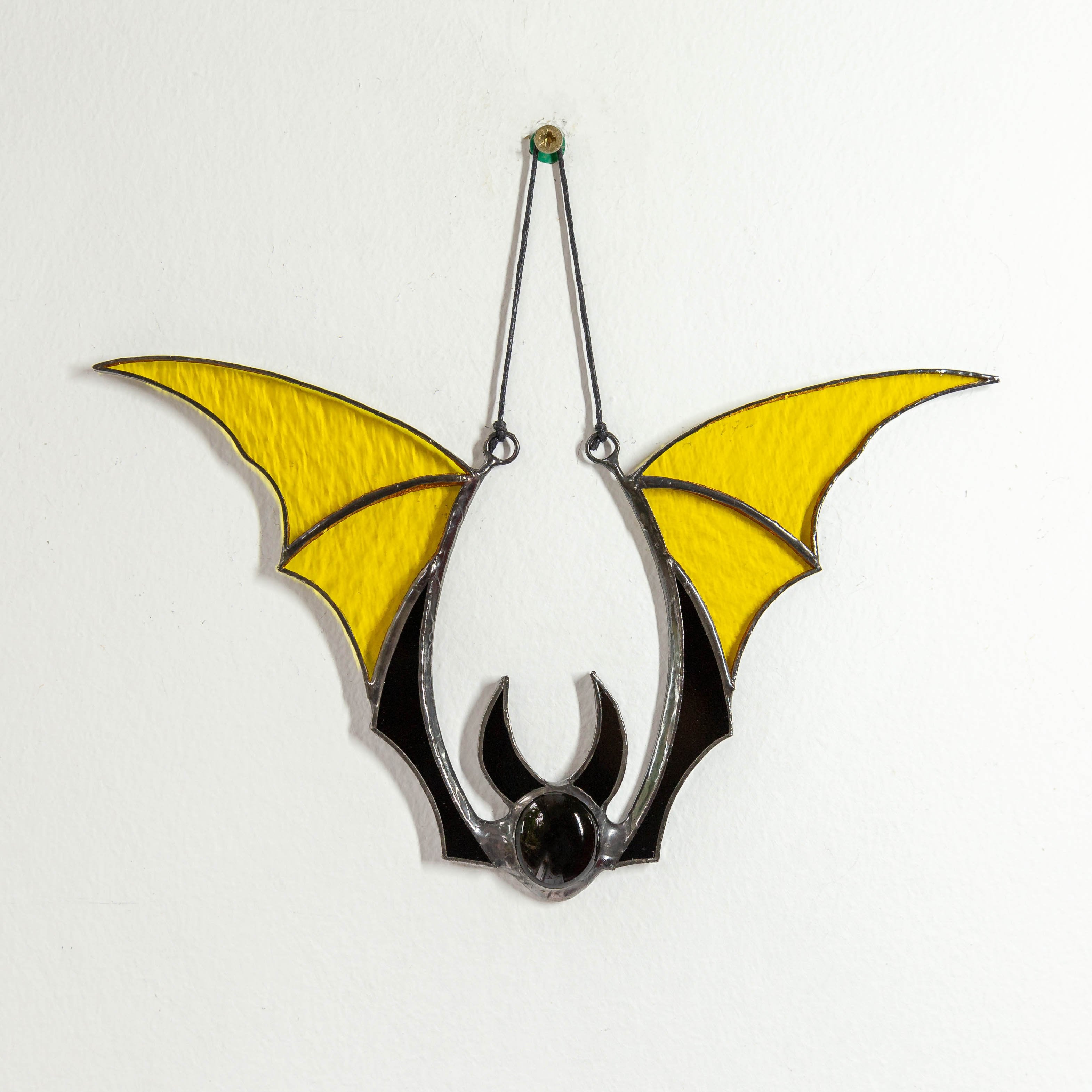 Suncatcher of a stained glass yellow-winged suncatcher