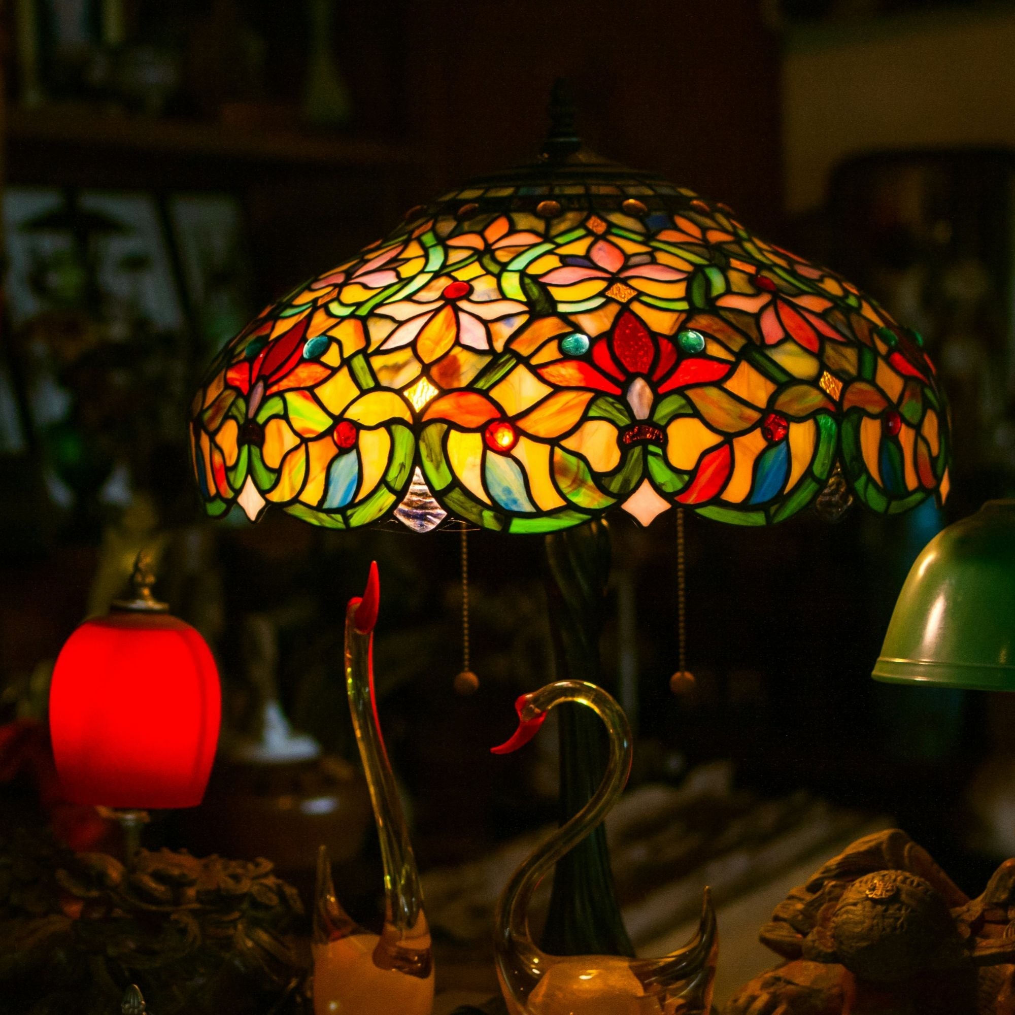 A colorful lamp with a glass shade