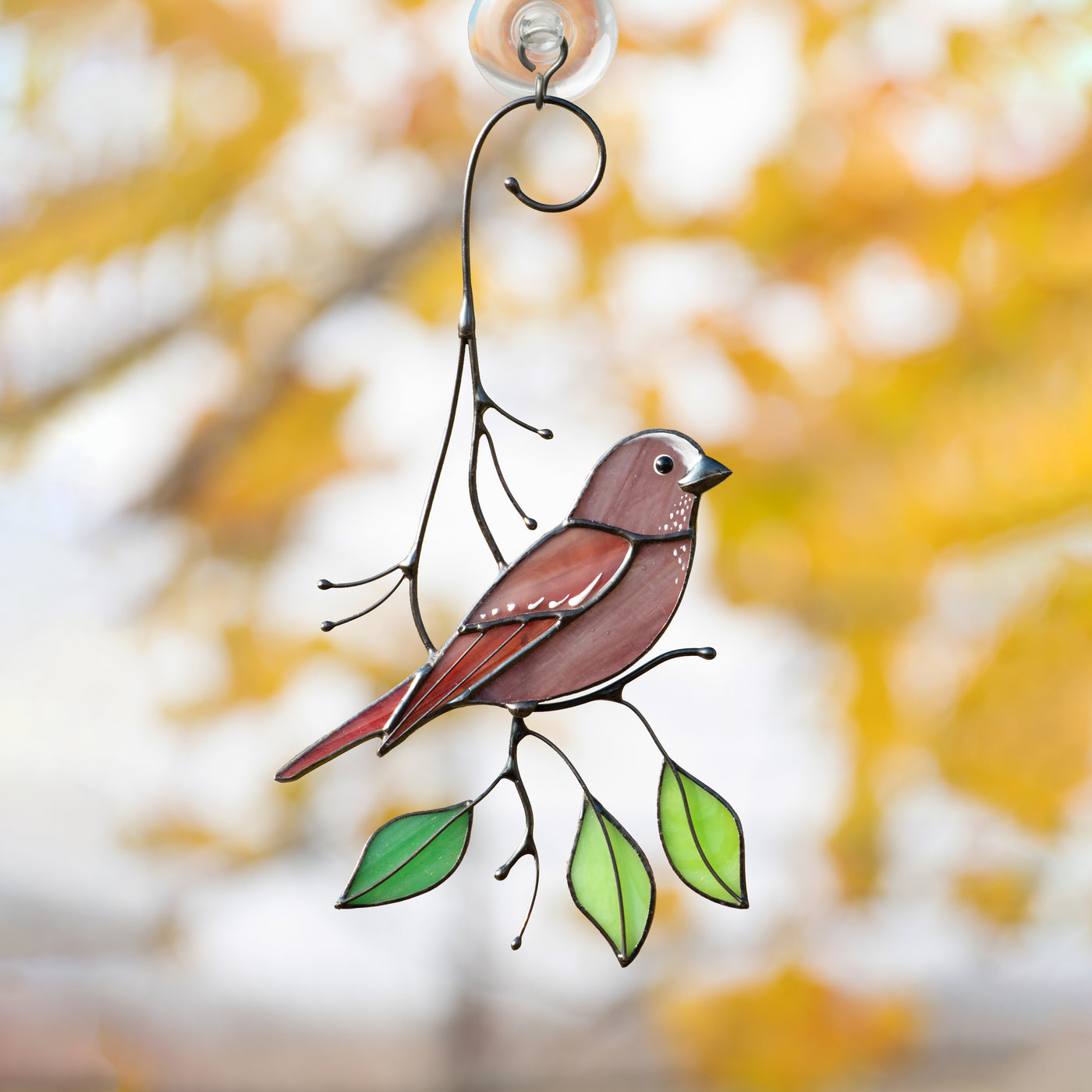 Stained glass rosefinch bird on the branch window hanging 