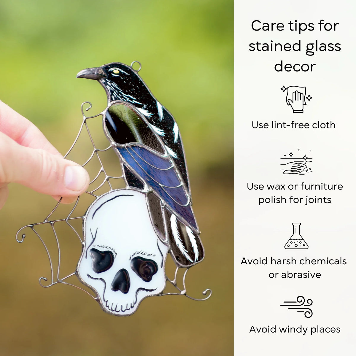 Care tips for a stained glass raven and skull suncatcher held outdoors - dust with a lint-free cloth, protect the joints with wax or furniture polish, and avoid harsh chemicals, abrasives, and windy places