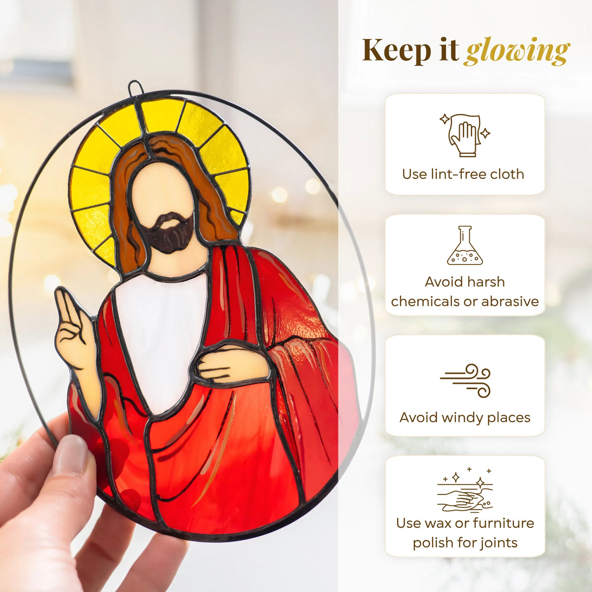 Hand holding the Jesus stained glass suncatcher - keep it glowing: clean with a lint-free cloth, avoid harsh chemicals and windy places, and use wax or furniture polish for the solder joints