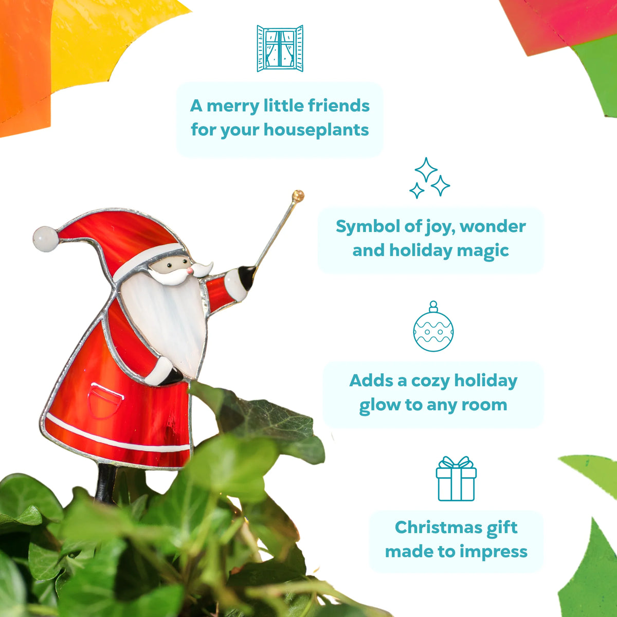 Santa stained glass plant stake in a pot of ivy - merry little friends for your houseplants, a symbol of joy and holiday magic that adds a cozy glow and makes a Christmas gift to impress