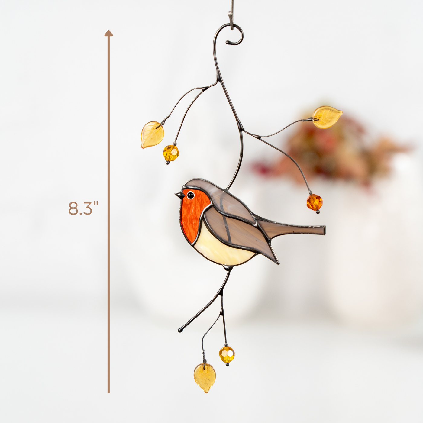 Close-up of robin bird suncatcher with 8.3-inch size indicator.
