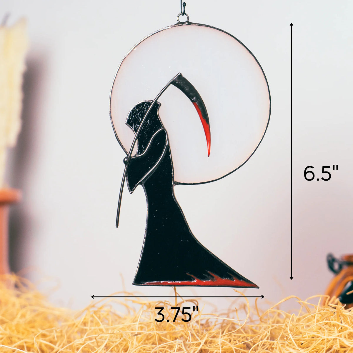 Size guide for the handmade Grim Reaper Halloween stained glass window hanging - 6.5 inches tall and 3.75 inches wide, a black reaper against a full moon