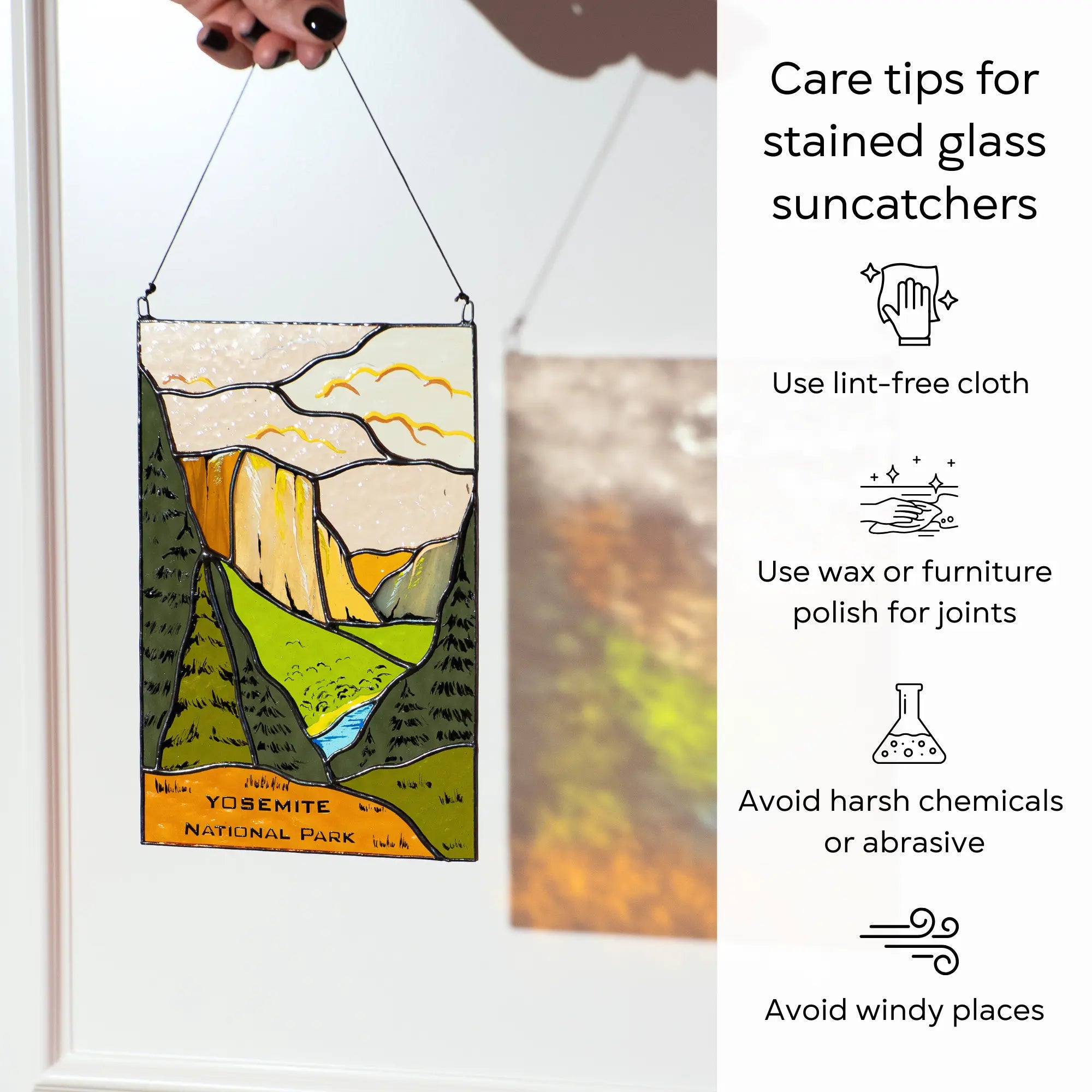 Stained glass suncatcher of Yosemite National Park with care tips on a white background: use lint-free cloth, polish joints with car wax or furniture polish, avoid harsh chemicals, and windy places.