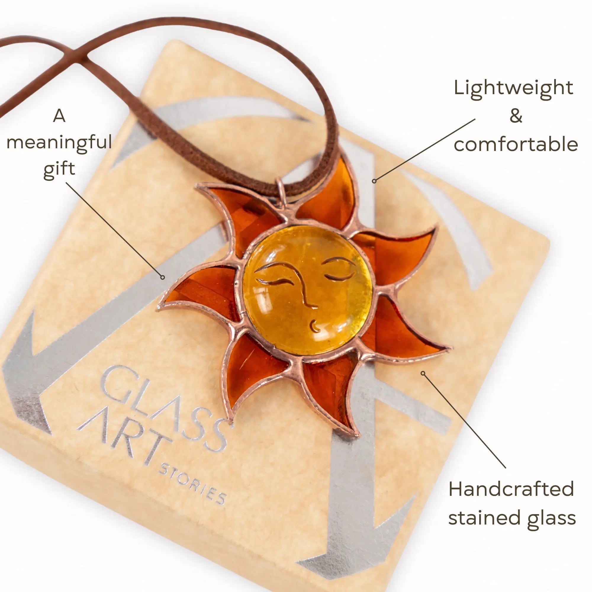 Sun pendant on branded box, labeled as a meaningful gift, lightweight, and handcrafted stained glass	