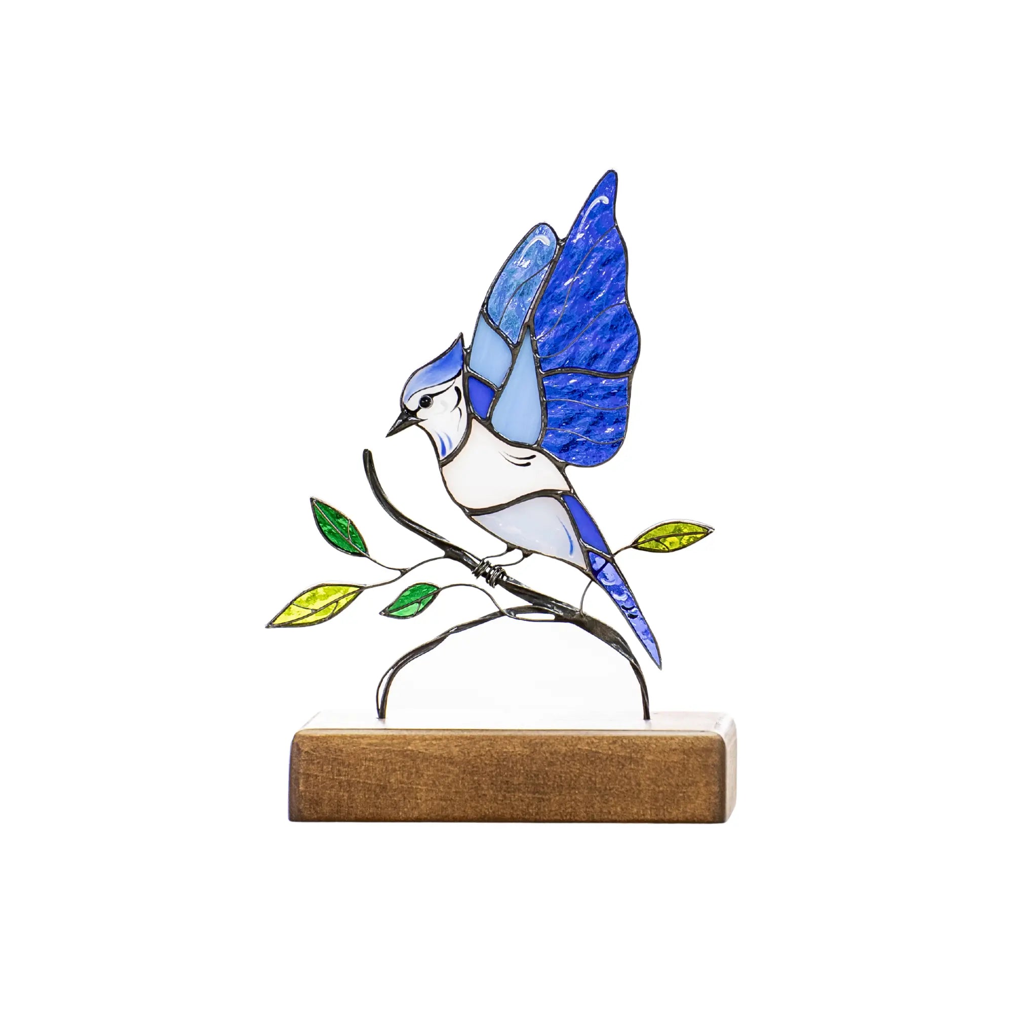 Product photo of stained glass blue jay on clean white background, upright on wooden stand