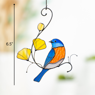Hanging stained glass suncatcher with bluebird and yellow flowers, size marker showing 6.5 inches