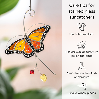 Close-up of a stained glass monarch butterfly with care tips for stained glass items listed next to it: use lint-free cloth, polish joints with car wax or furniture polish, avoid harsh chemicals, and windy places.