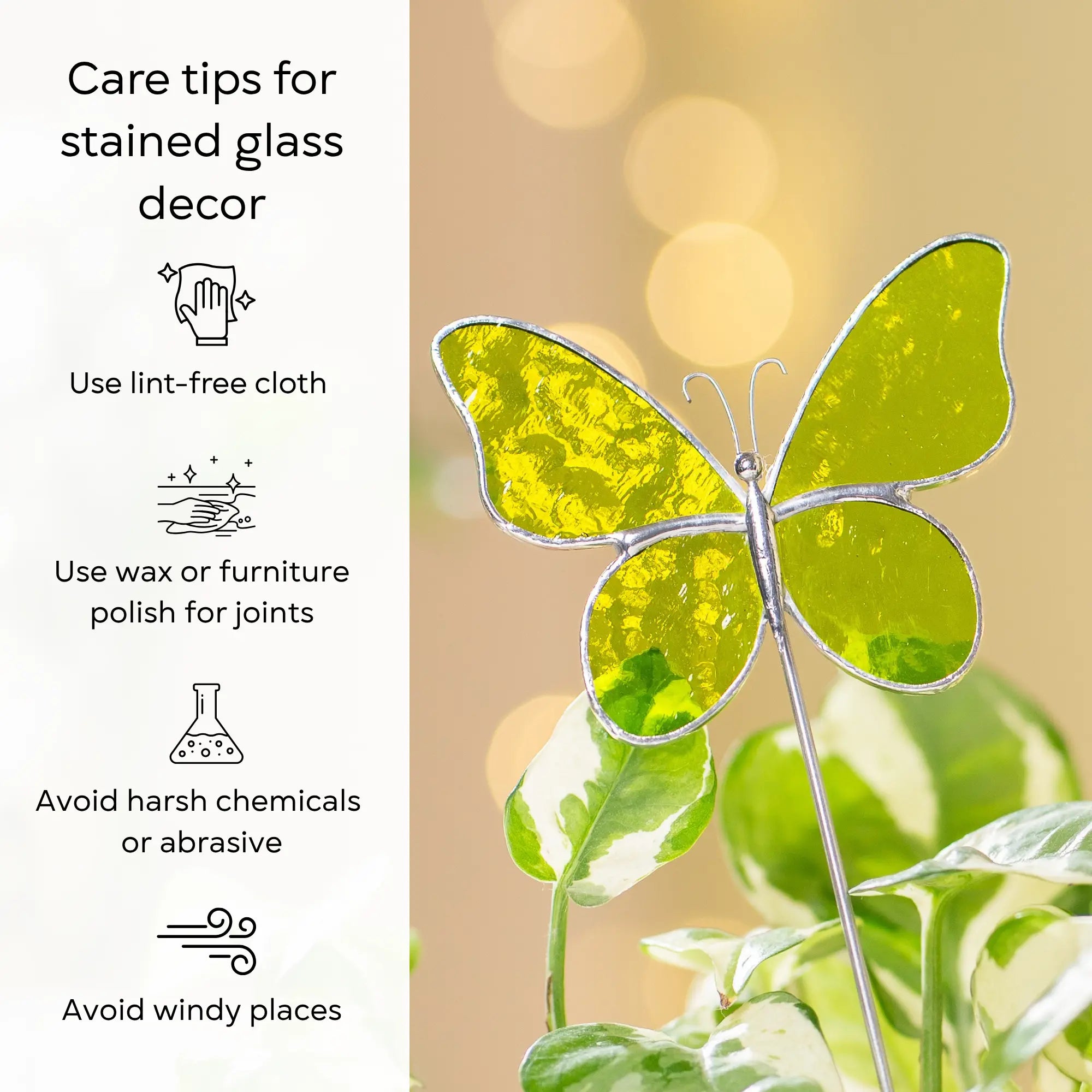 Butterfly stained glass plant stake with care tips on a blurred background: use lint-free cloth, polish joints with car wax or furniture polish, avoid harsh chemicals, and windy places.