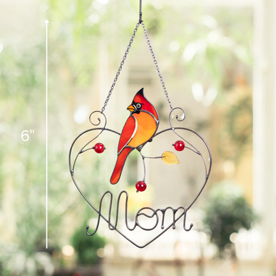 Stained glass cardinal bird ornament hanging indoors with text label showing height: 6 inches.