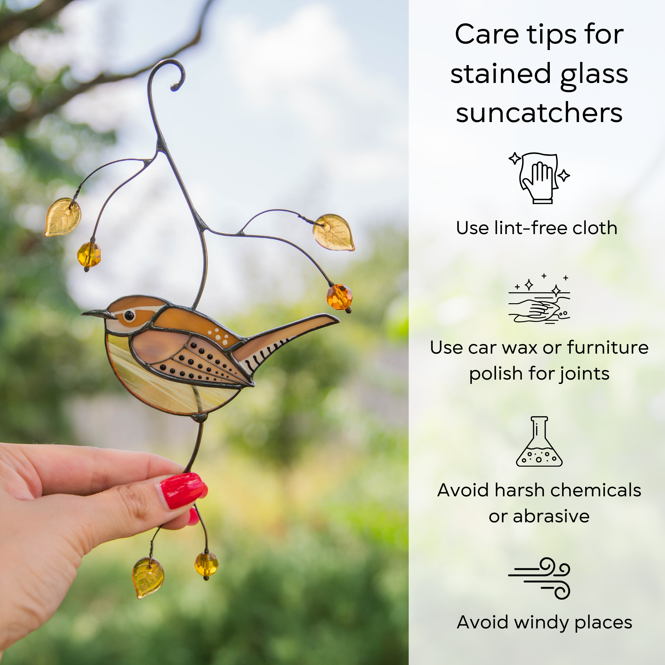 Hand holding a Carolina wren stained glass suncatcher with care tips: use lint-free cloth, avoid chemicals and windy places