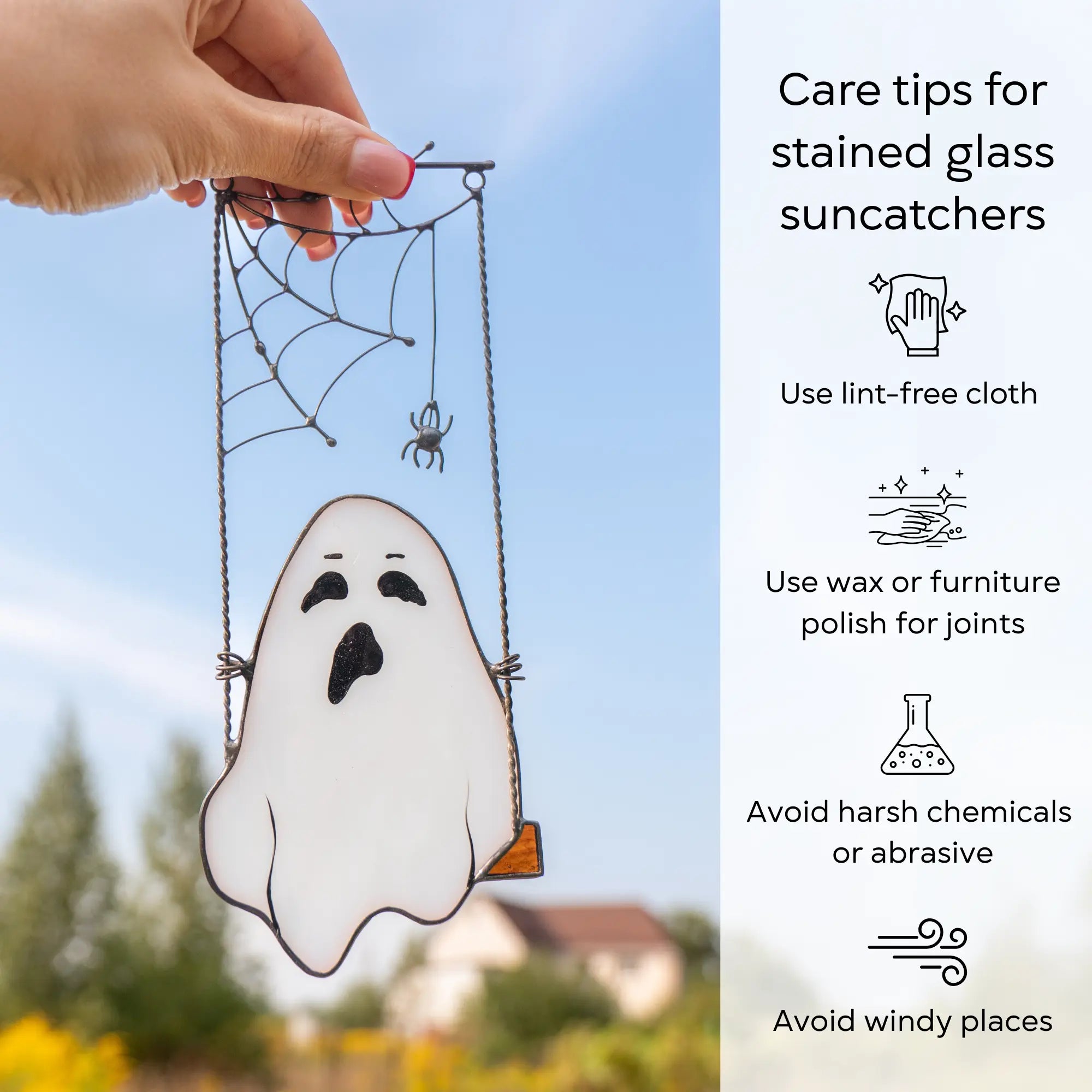 Stained glass ghost suncatcher with care tips on a blue sky background: use lint-free cloth, polish joints with car wax or furniture polish, avoid harsh chemicals, and windy places.