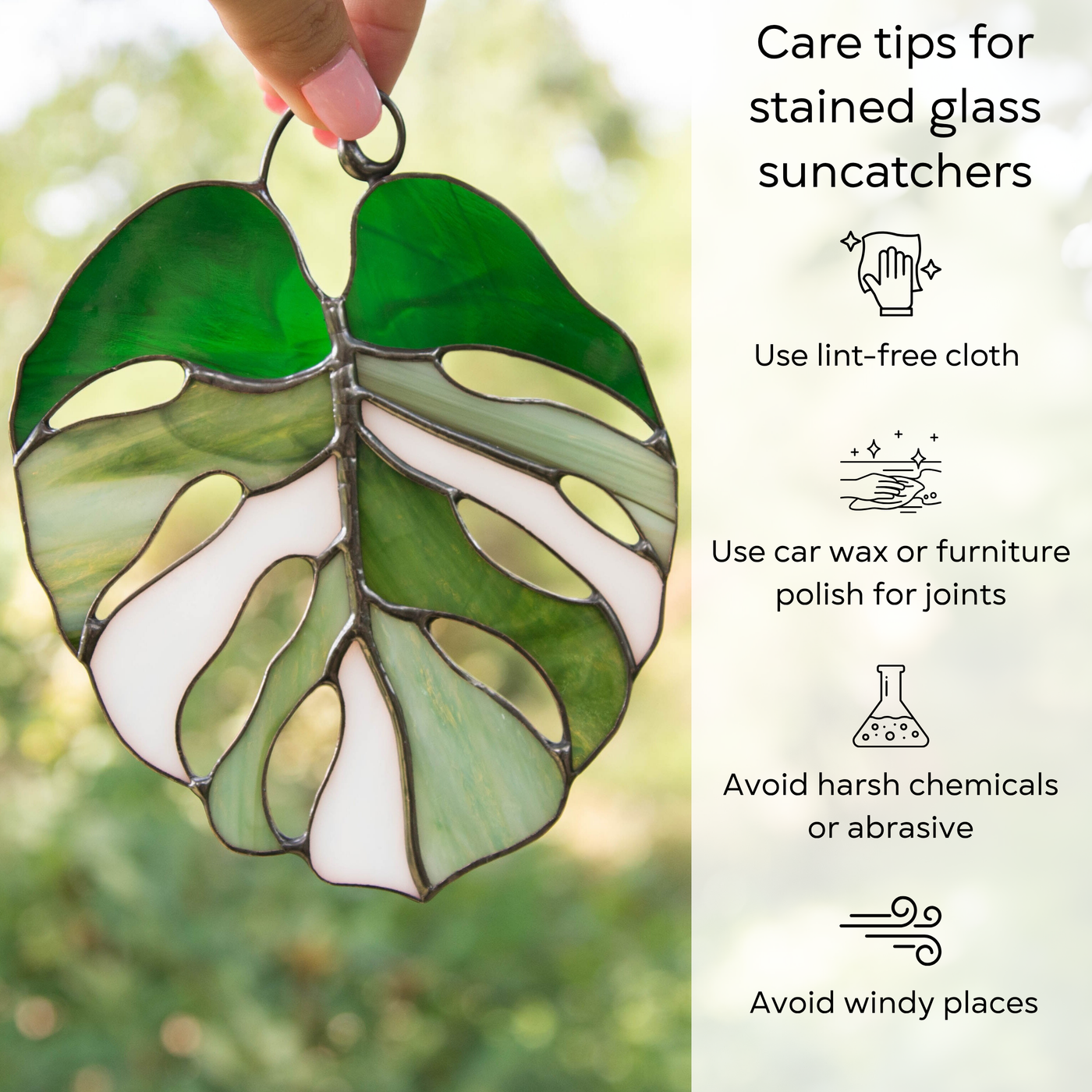 Hand holding monstera stained glass suncatcher with text: care tips include using polish, soft cloth, and avoiding wind