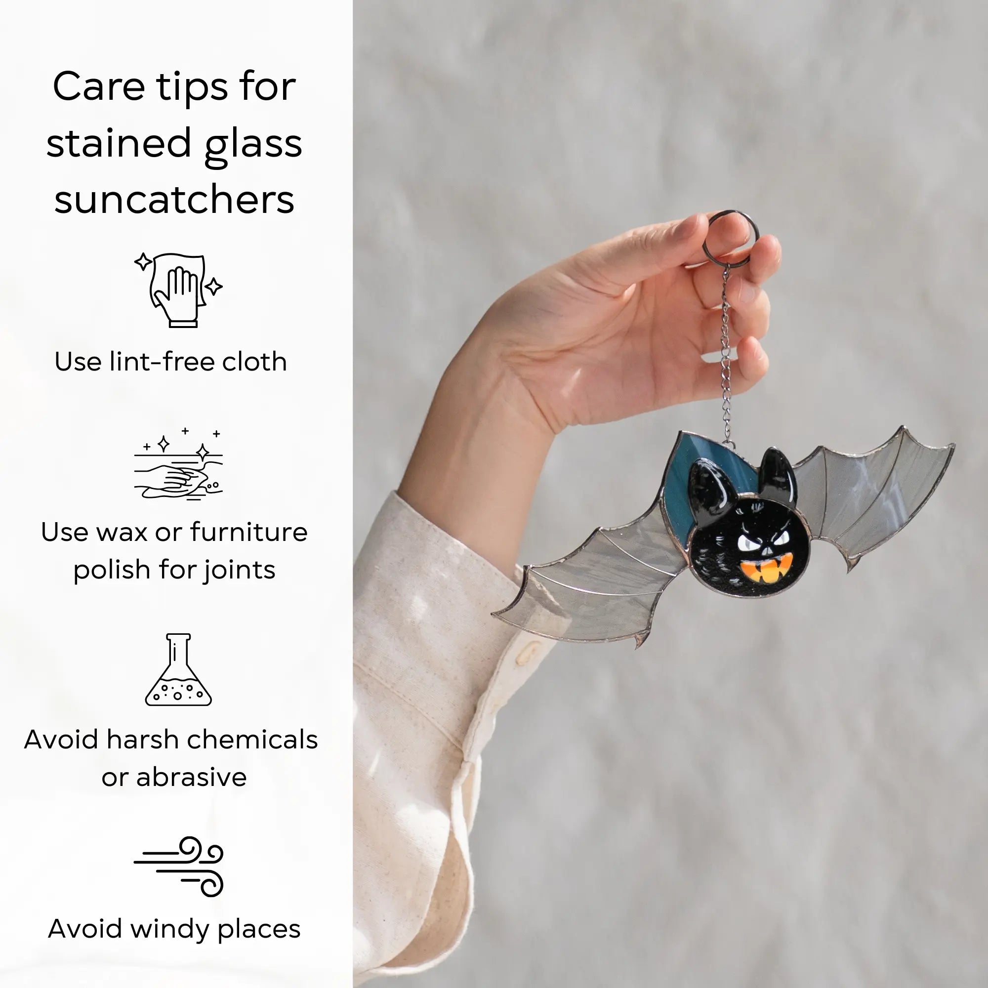 Hand holding a bat-shaped stained glass suncatcher with care tips on the left: use lint-free cloth, polish joints with car wax or furniture polish, avoid harsh chemicals, and windy places.