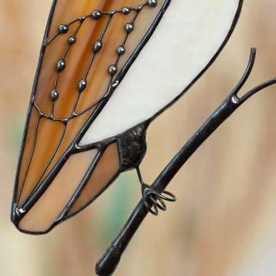 Detailed view of the wing on a stained glass owl, showing wing details and layered glass segments