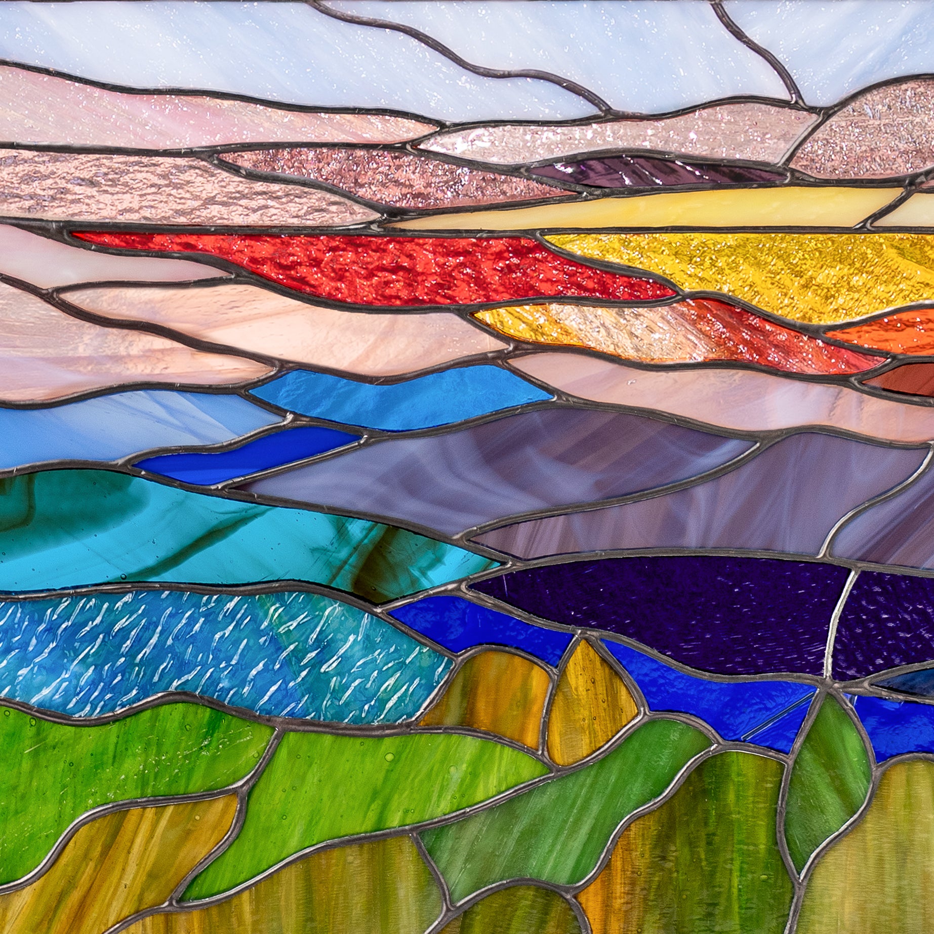 Close-up view of stained glass panel featuring Blue Ridge national park 