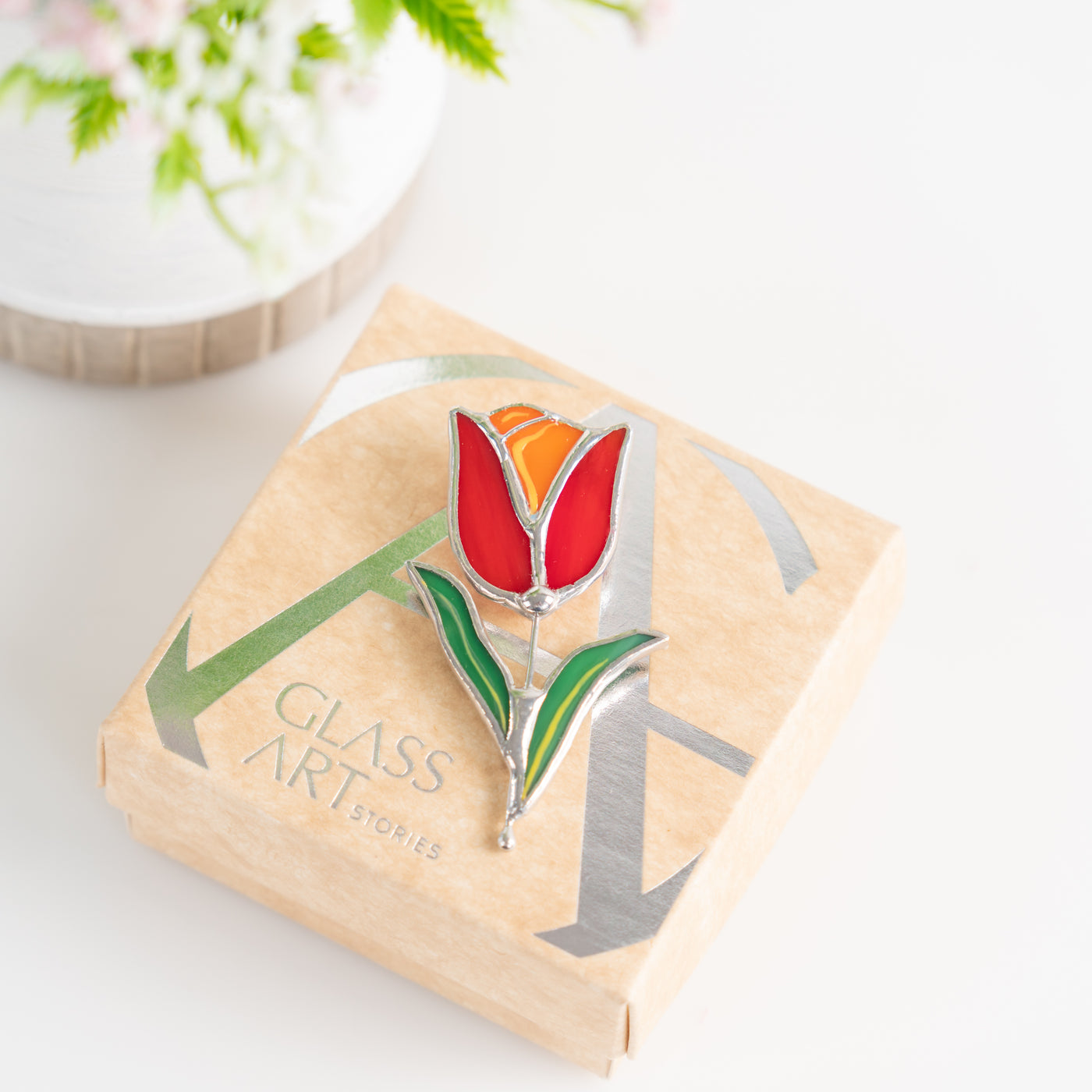 Stained glass red flower pin and a brand box