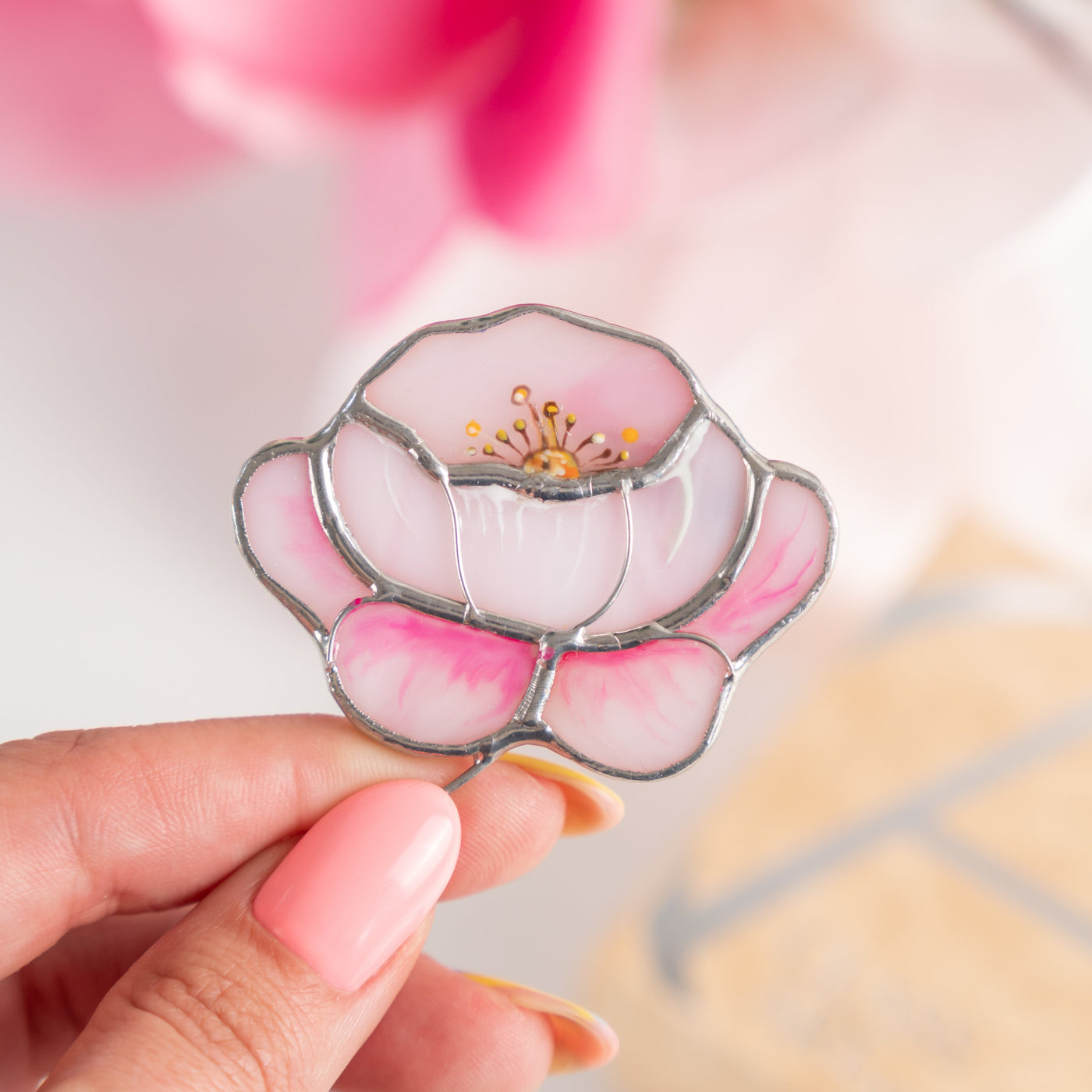 Zoomed stained glass brooch of a peony