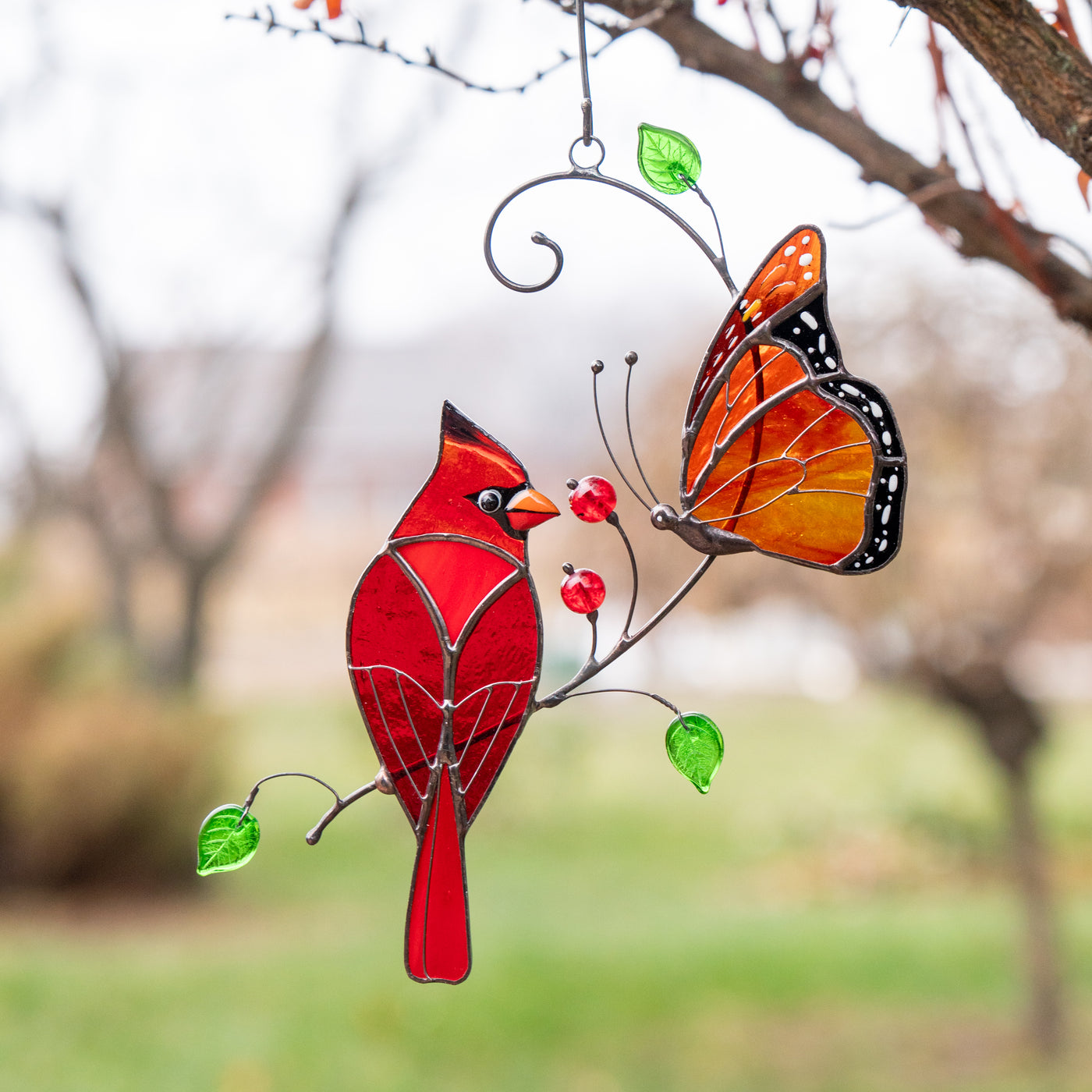 cardinal and butterfly ornament made of modern stained glass
