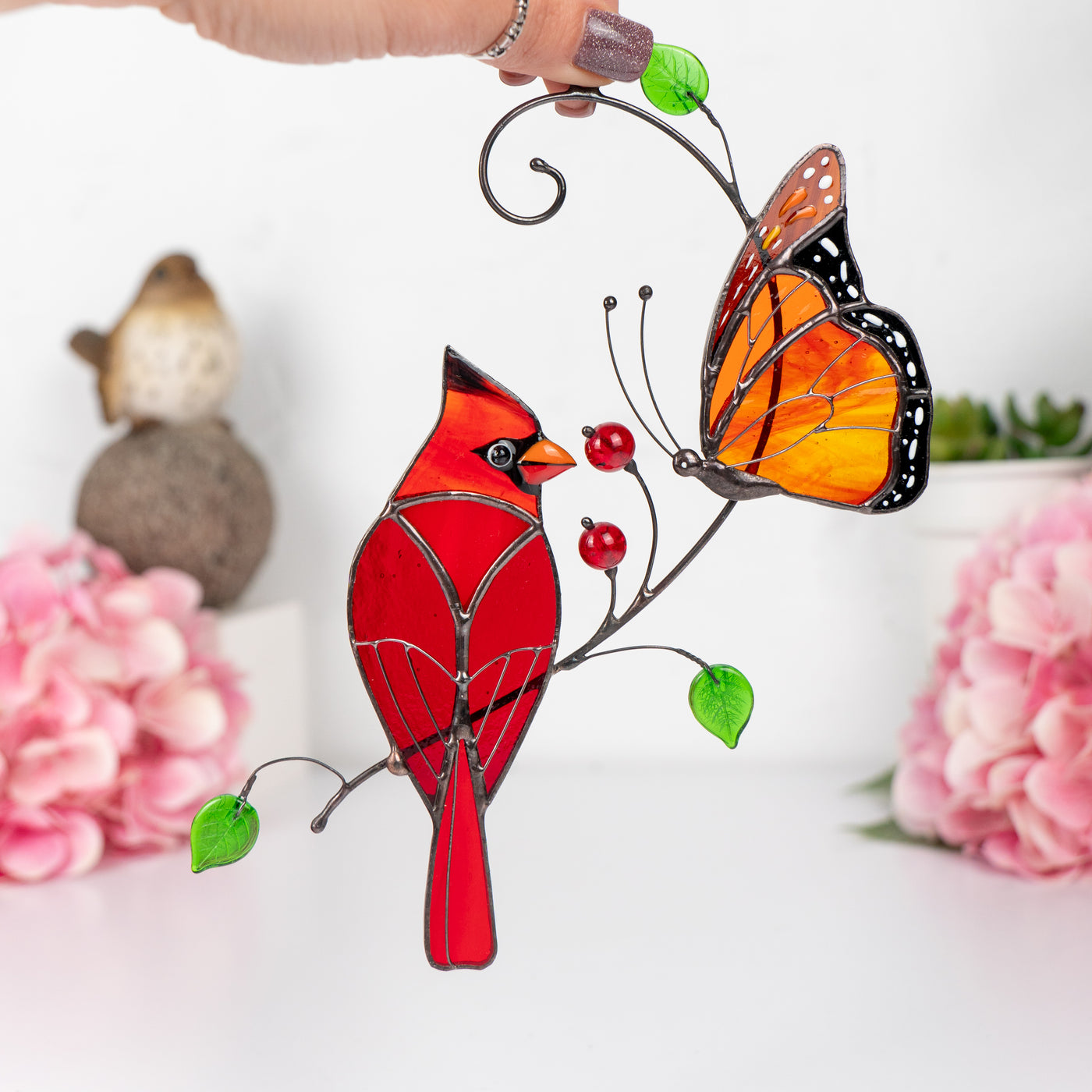 stained glass suncatcher of male cardinal bird and monarch butterfly
