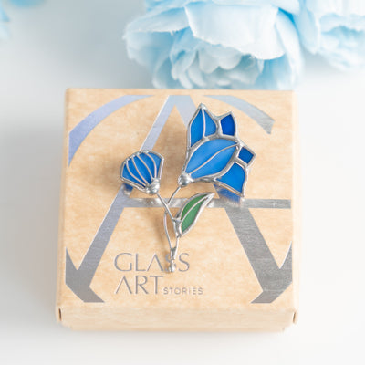 Bluebell brooch of stained glass on a brand box