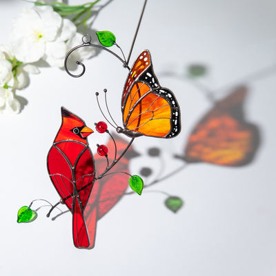 cardinal bird and monarch butterfly item made of modern stained glass
