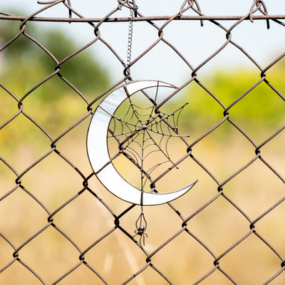 stained glass moon with spider ornament