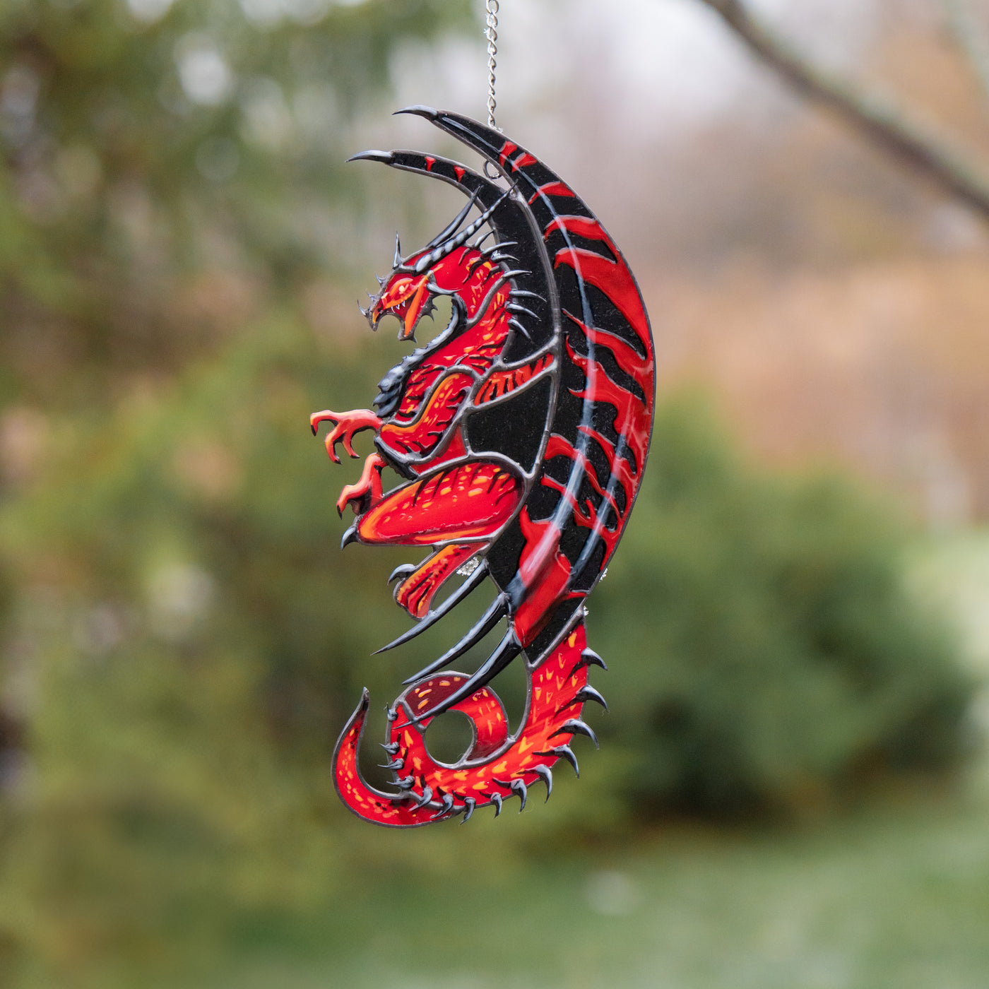 red dragon light catcher made of stained glass
