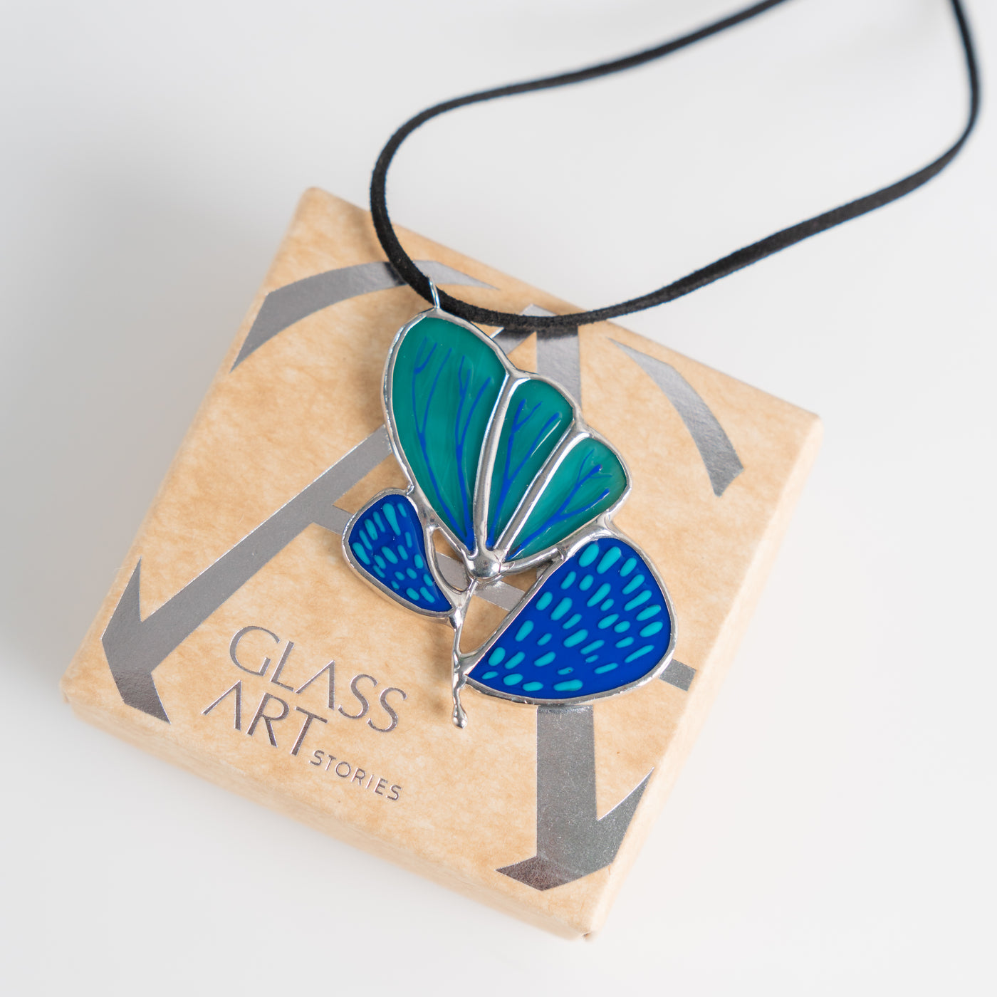 blue flower pendant made of stained glass