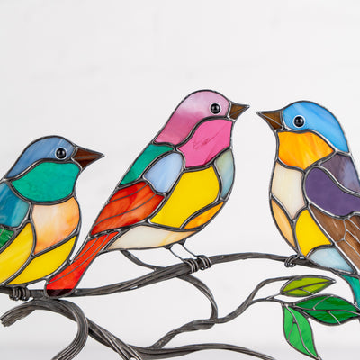 3 stained glass birds on the branch