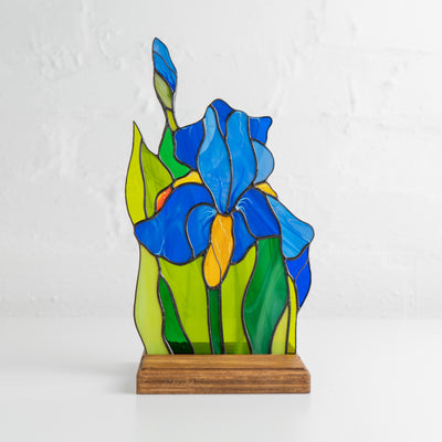 Stained glass blue iris flower panel in a wooden base for table decor