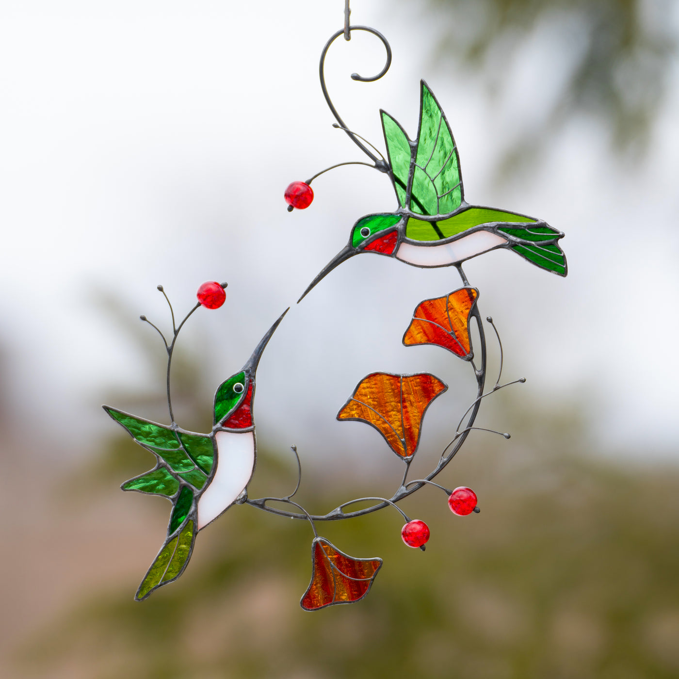 two flying green hummingbirds window hanging made of modern stained glass
