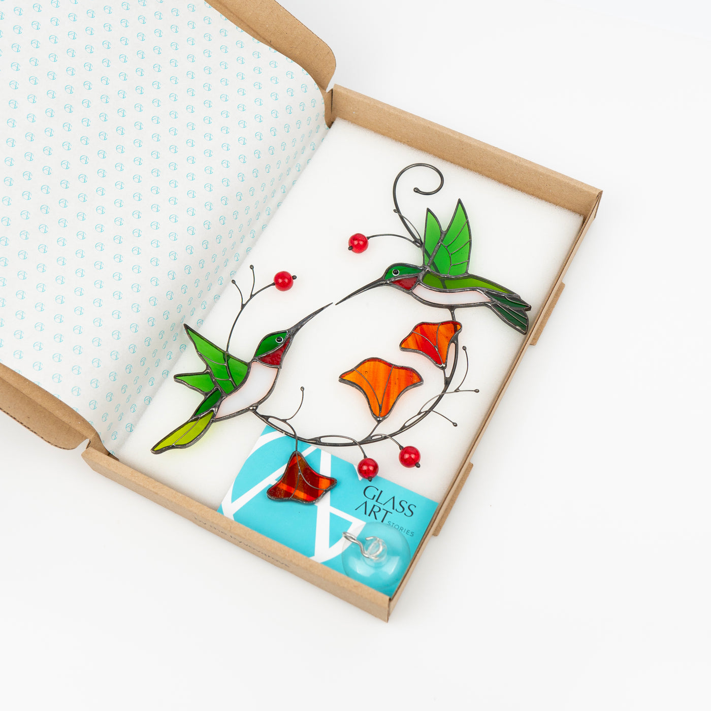 Stained glass couple of green hummingbirds in a brand box