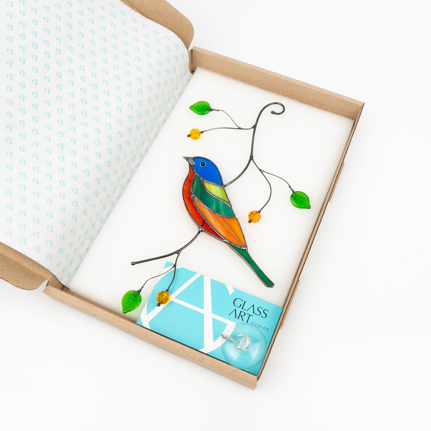 Painting bunting bird suncatcher of stained glass in a brand box