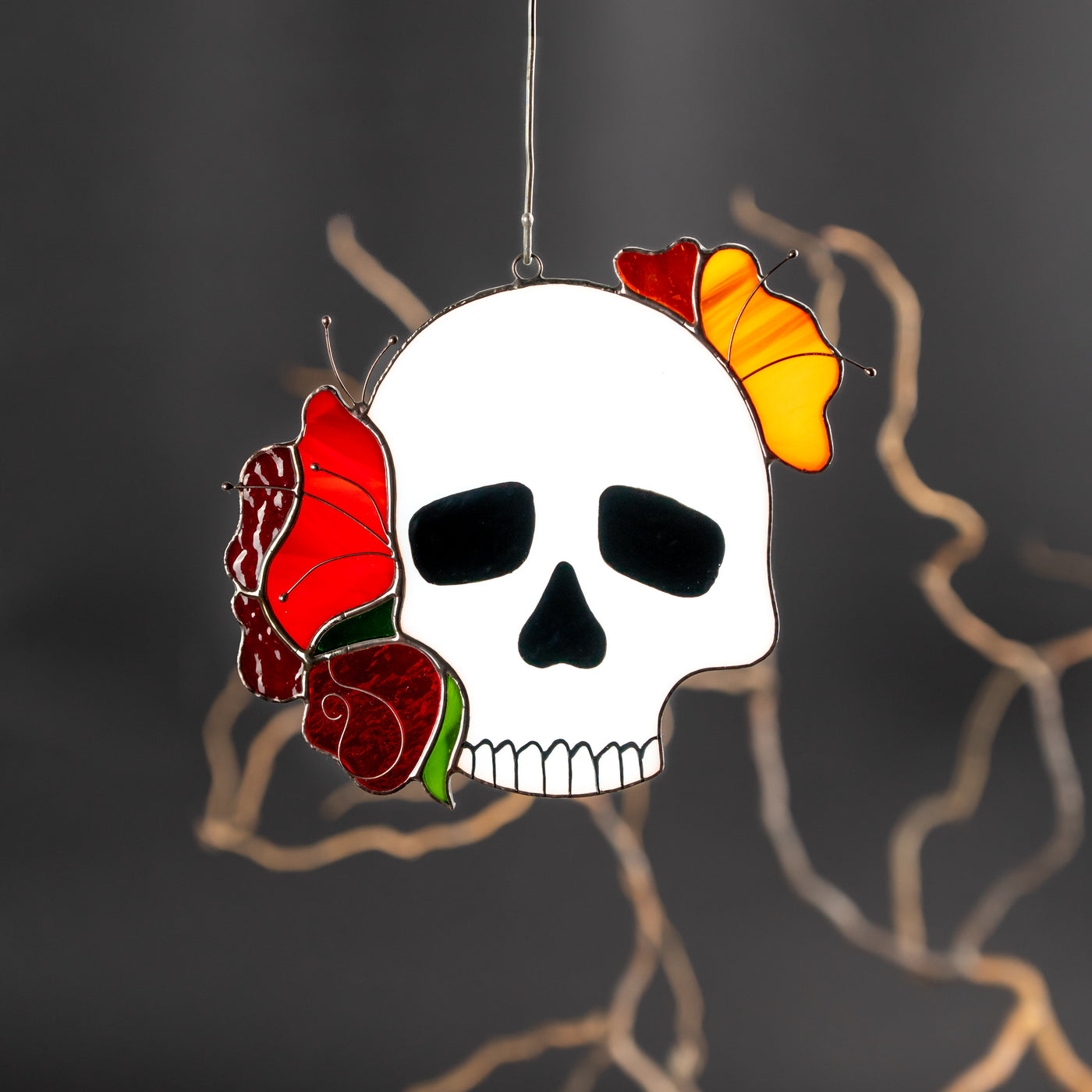 stained glass white human skull with red and yellow roses