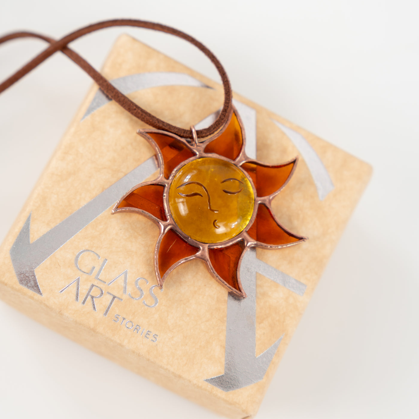 stained glass jewelry of sun