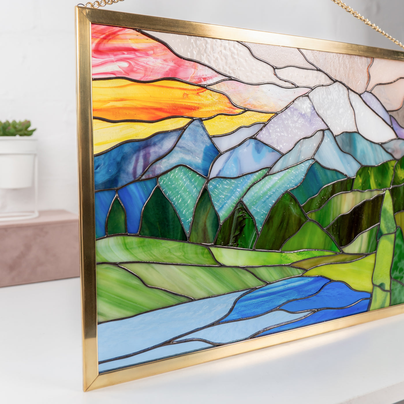 Glacier panel made of stained glass in the golden frame