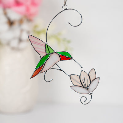 stained glass hummingbird with the white iridescent flower